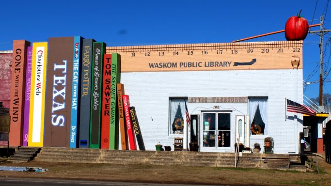 Mural of books with ruler "Waskom Public Library"