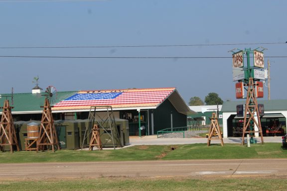 Mural of U.S.A. Banner on roof of building