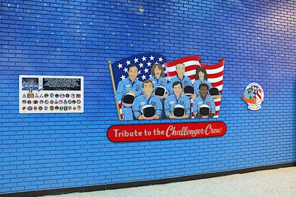 Mural of astronauts and the U. S. A. Banner on a school wall
