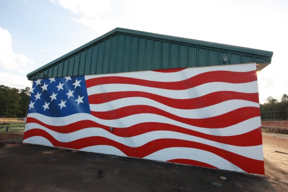 Mural on side of a building with U. S. A. Banner